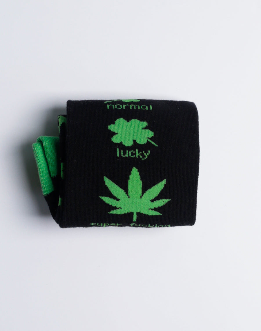 Flat-lay image of the Super Lucky Weed Leaf Crew Socks, displaying their eye-catching design and soft, breathable material.