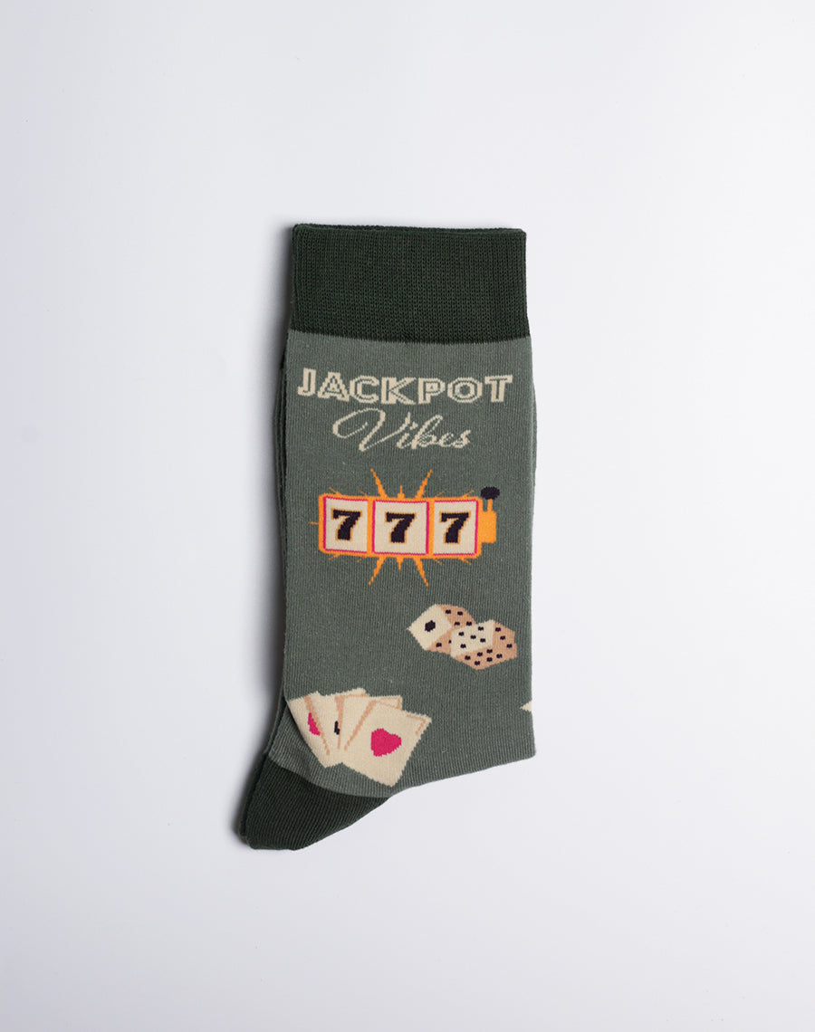Casino-inspired dark green socks for men, featuring slot machines, jackpot symbols, and playing cards.