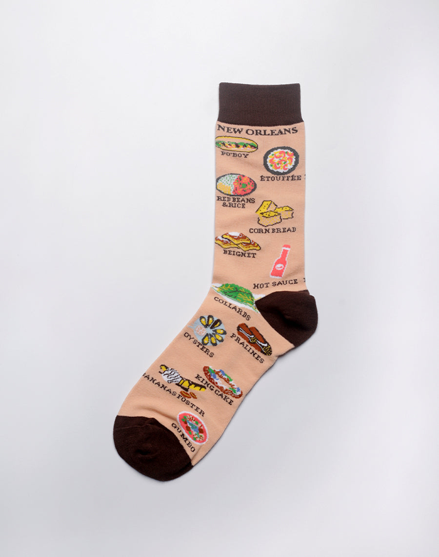 Close-up of beige New Orleans food themed socks for men