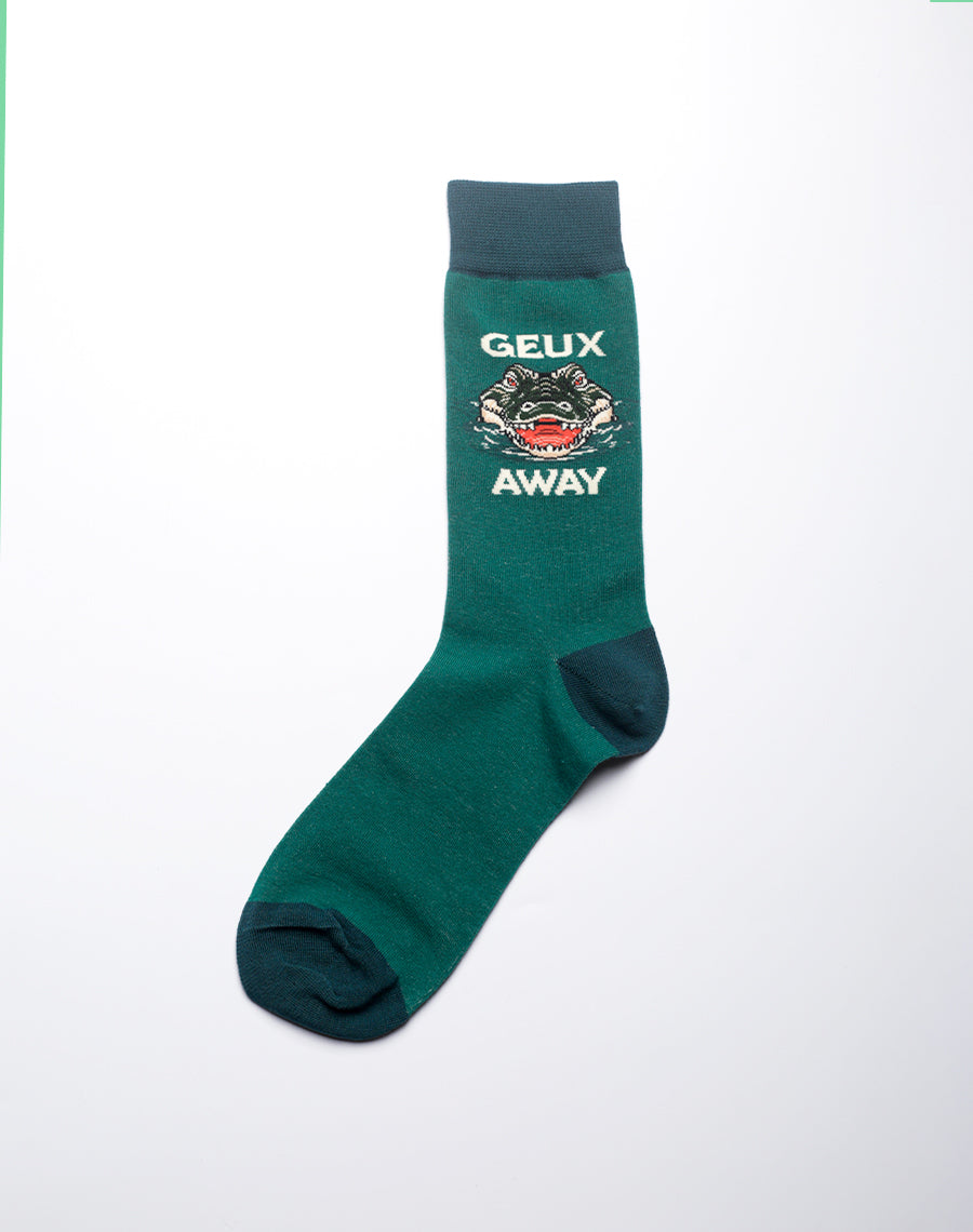 Close-up of green alligator themed crew socks