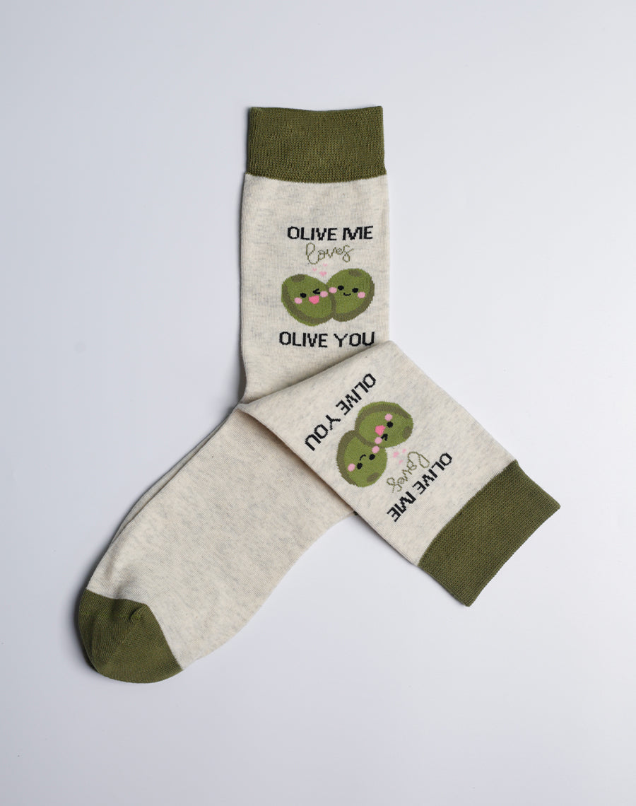 A pair of olive green crew socks featuring a playful "Olive Me Loves Olive You" design with cute olive illustrations.