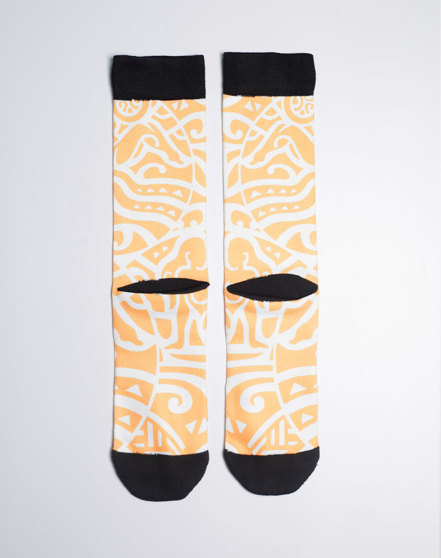Golden tribal printed Maui Brewing Co. socks inspired by Bikini Blonde Lager, available with free U.S. shipping.