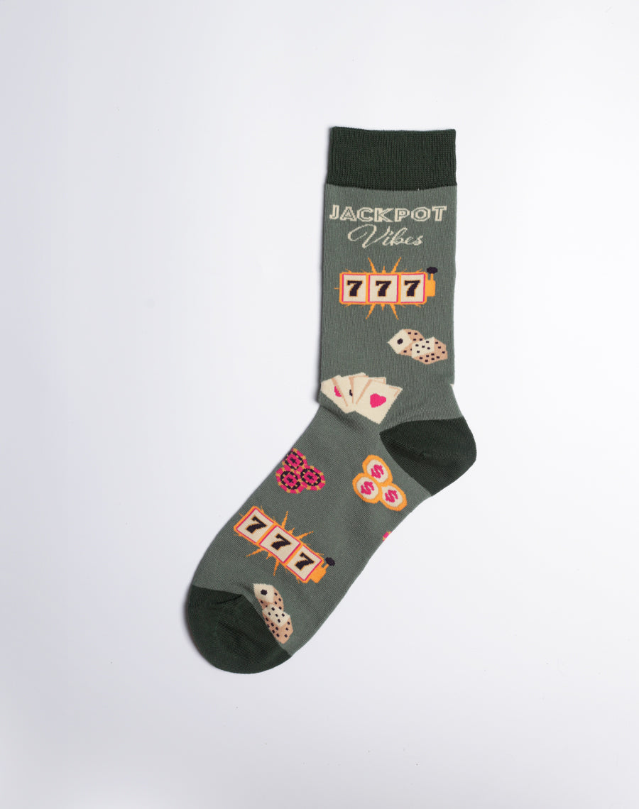 Las Vegas-inspired men's socks in dark green, showcasing gambling motifs like playing cards, dice, and jackpot symbols.