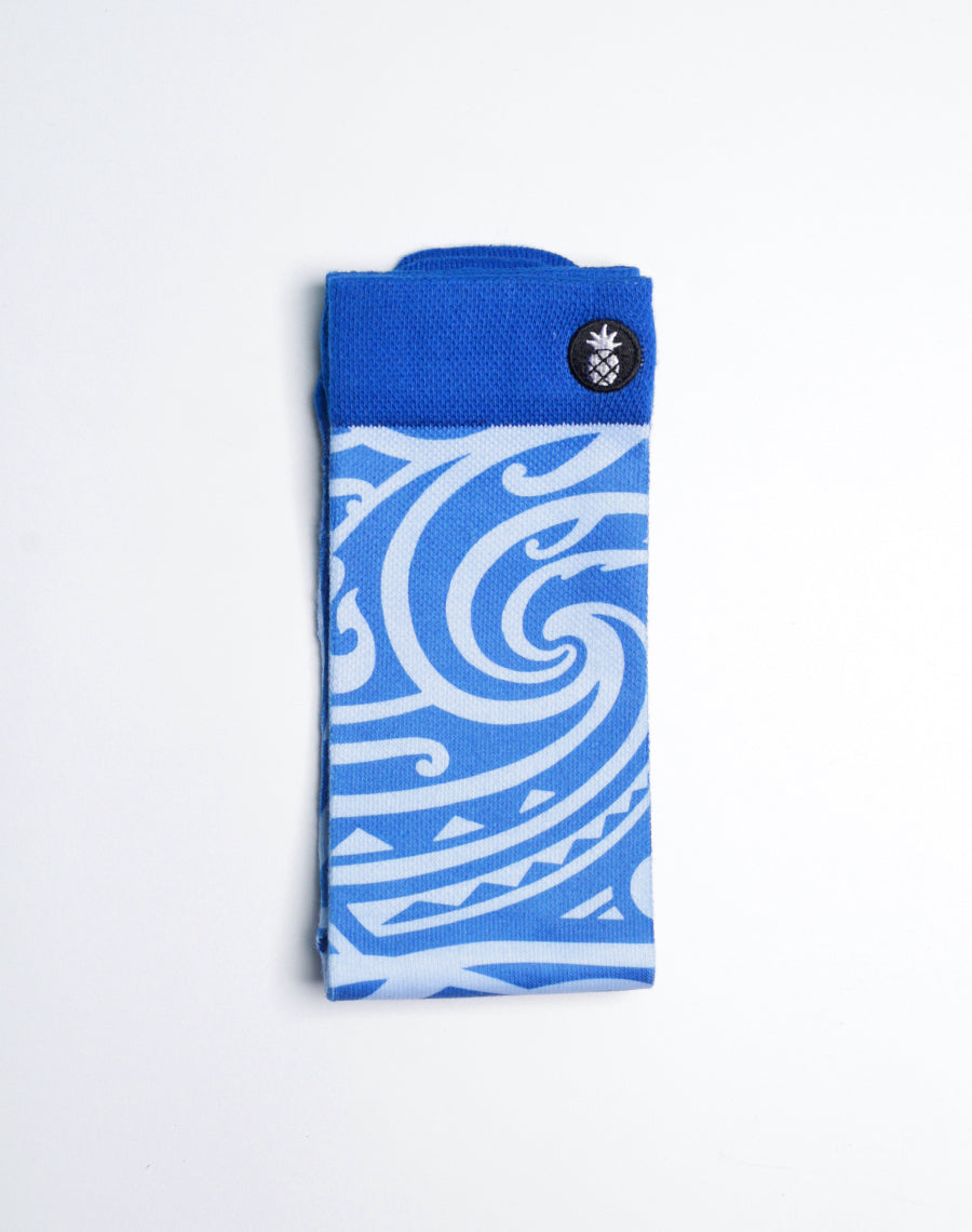 Maui Brewing Co. IPA crew socks featuring island surf patterns, ribbed cuff, and arch support.