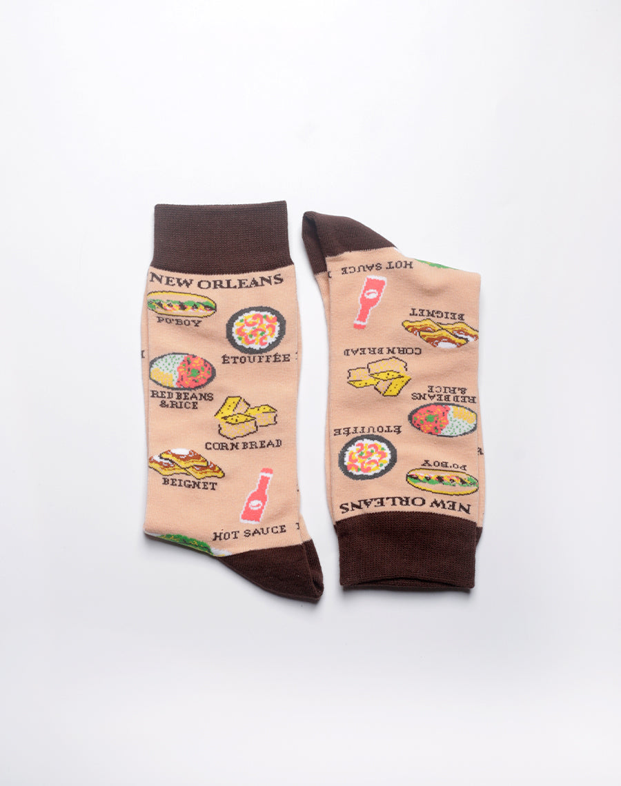 Men's beige NOLA themed socks featuring classic Louisiana cuisine prints