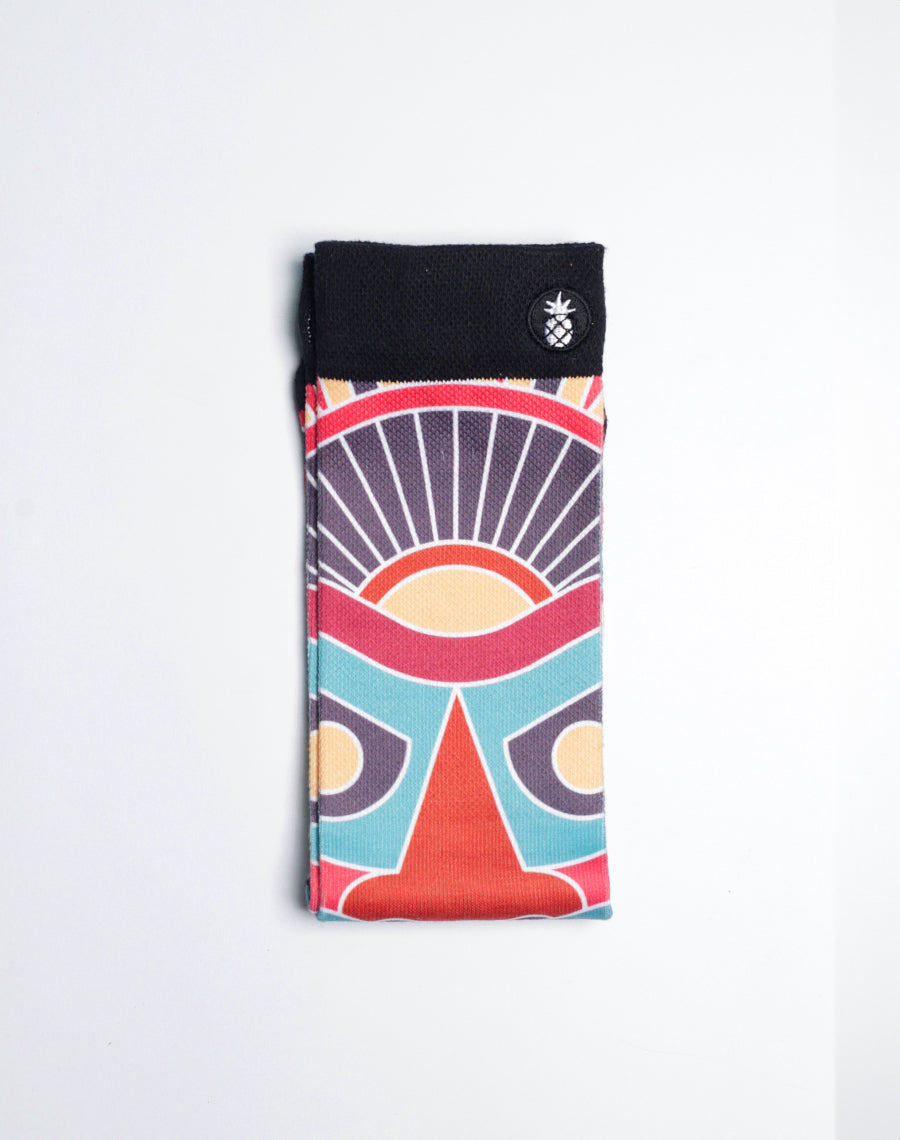 Premium cotton-polyester blend crew socks with tiki mask print, arch support, and stay-up ribbed cuff.