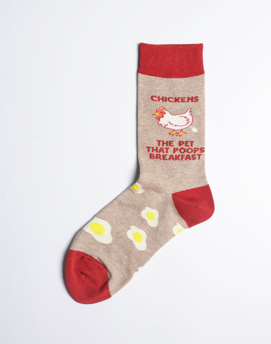 Close-up of the Women's Chickens Crew Socks, showcasing the playful "The Pet That Poops Breakfast" slogan.
