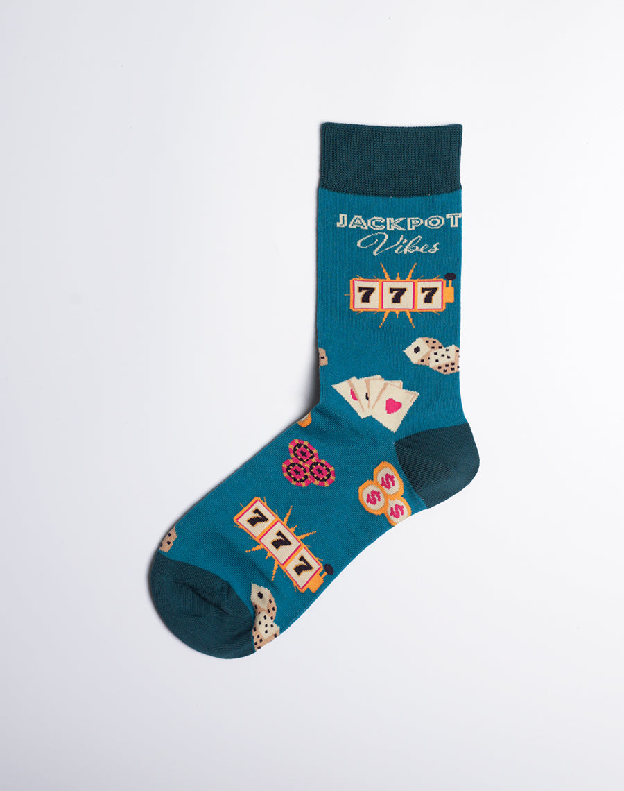 Fun and vibrant Las Vegas-inspired socks with a teal background, decorated with dice, playing cards, and jackpot symbols.