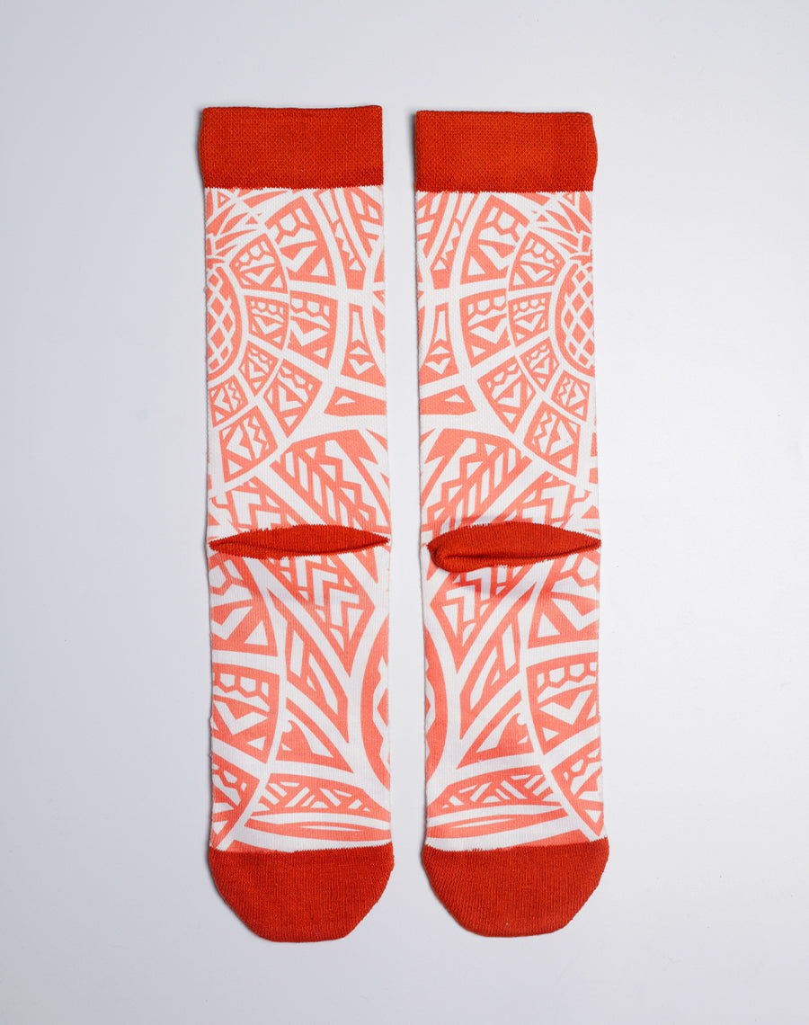 Tropical pineapple-themed Maui Brewing socks in orange and white design.