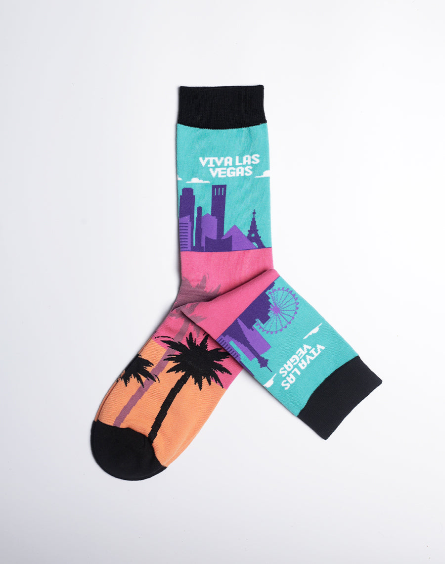Colorful Las Vegas-themed crew socks featuring a vibrant skyline and sunset palm trees.