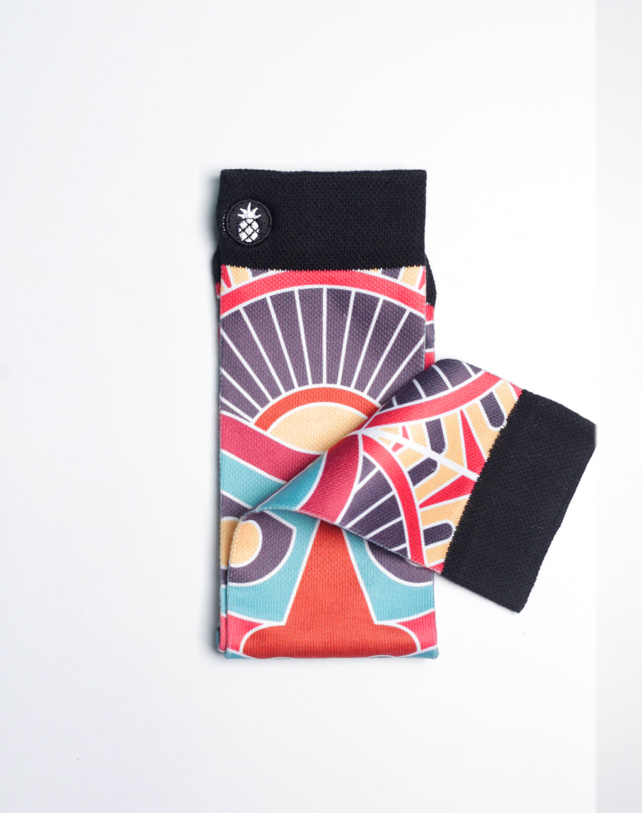 Vibrant tiki-inspired printed crew socks combining Hawaiian art with all-day comfort and moisture-wicking fabric.
