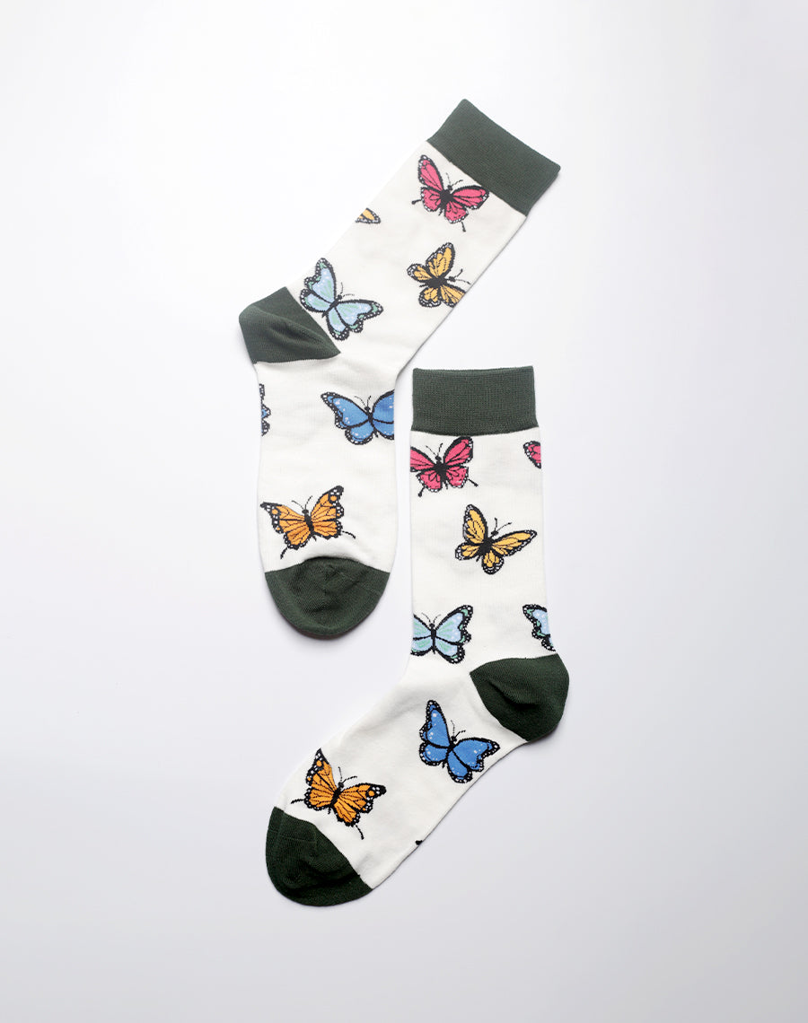 Women’s novelty socks with multicolor butterfly clusters on a stylish background