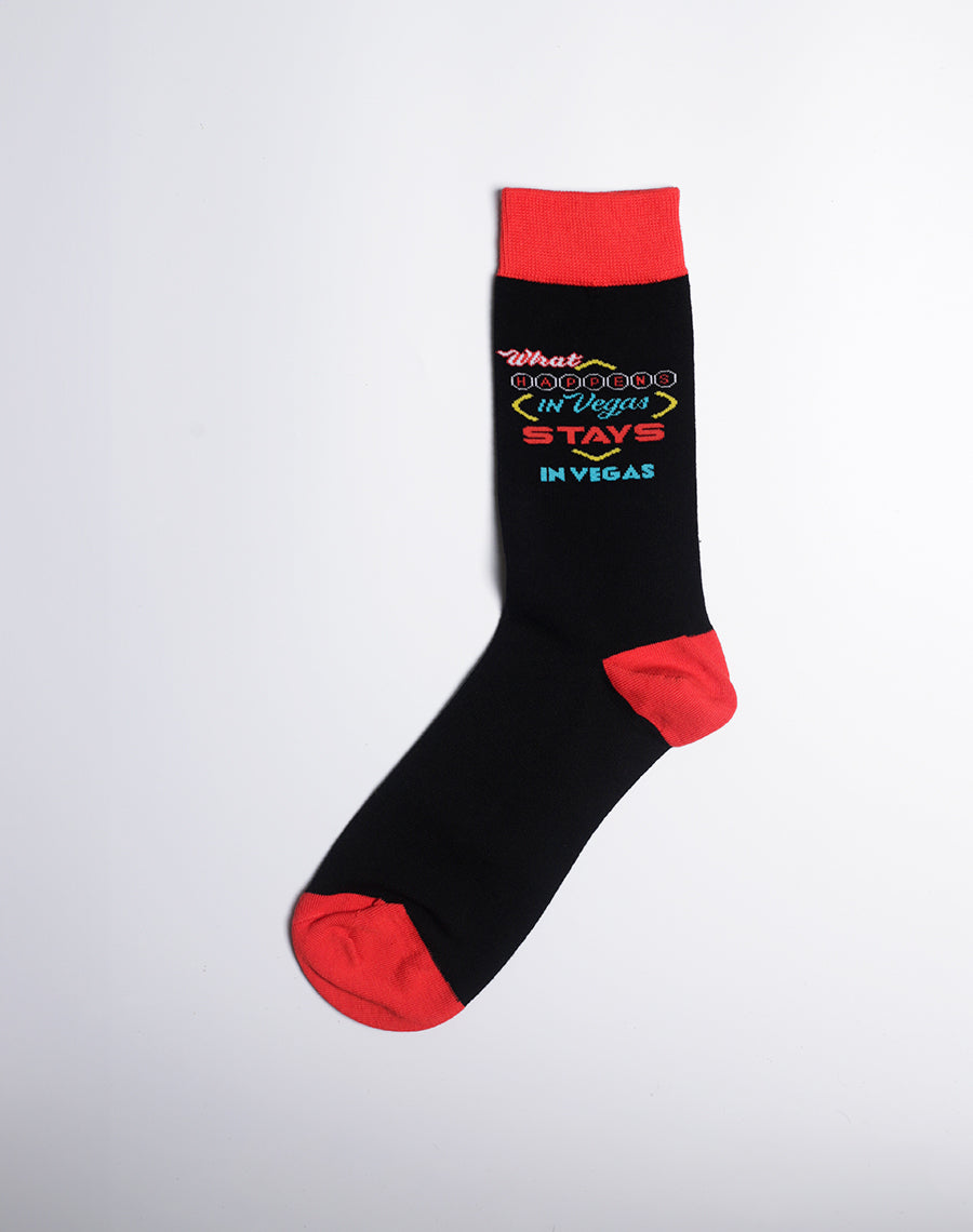 Men's novelty socks with a bold "What Happens in Vegas" design, perfect for party lovers.