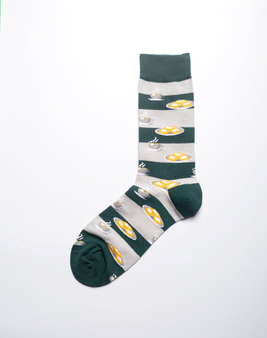 Close-up of Green dessert themed crew socks