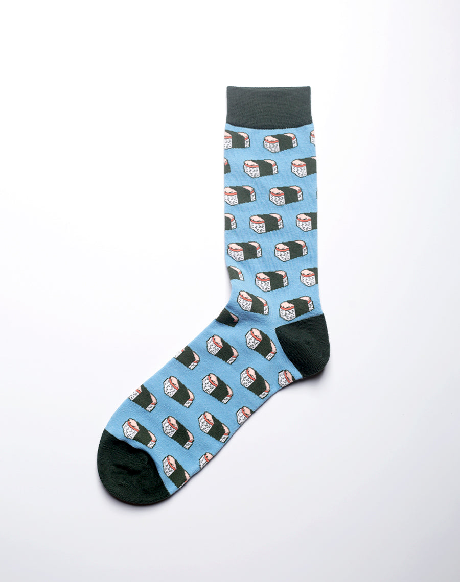 Close-up of blue novelty socks with spam musubi pattern