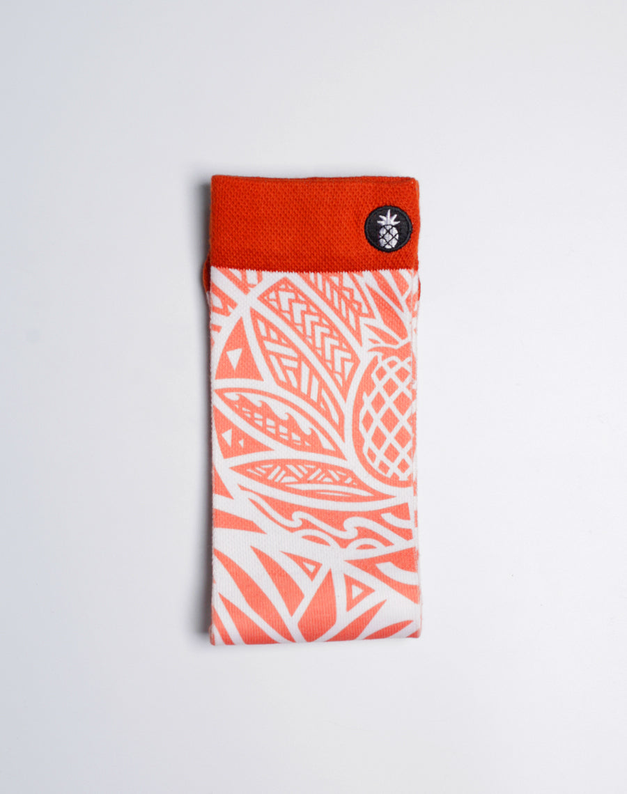 Cotton-blend crew socks with moisture-wicking fabric and Hawaiian pineapple print.
