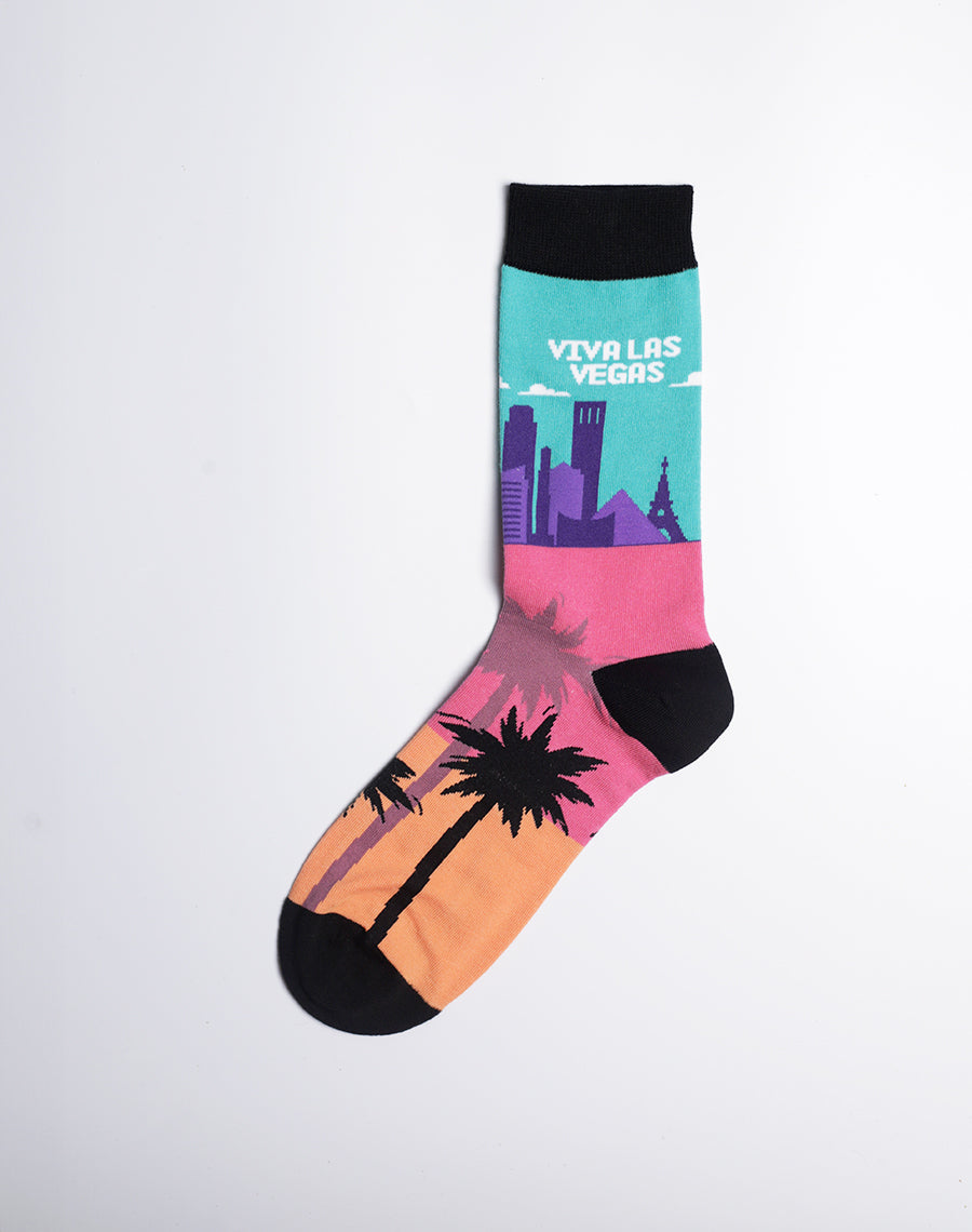 Bright and fun crew socks showcasing the iconic Las Vegas Strip and palm trees at sunset.