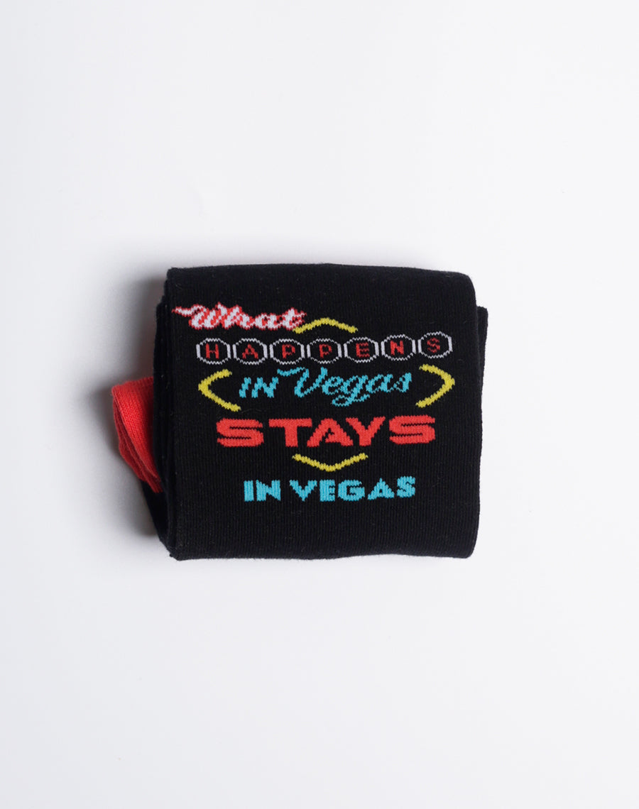 Black and red socks with a playful Las Vegas slogan, ideal for casino enthusiasts.