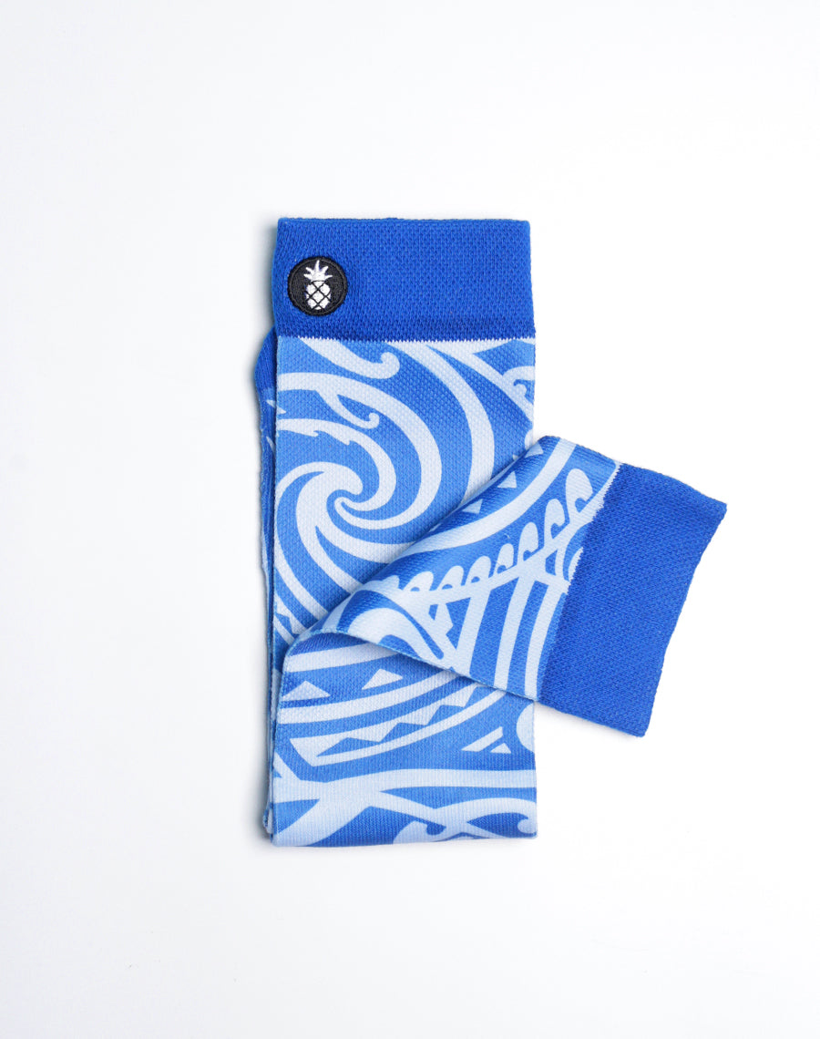 Officially licensed Maui Brewing Big Swell IPA socks with bold tribal surf design and reinforced heel.