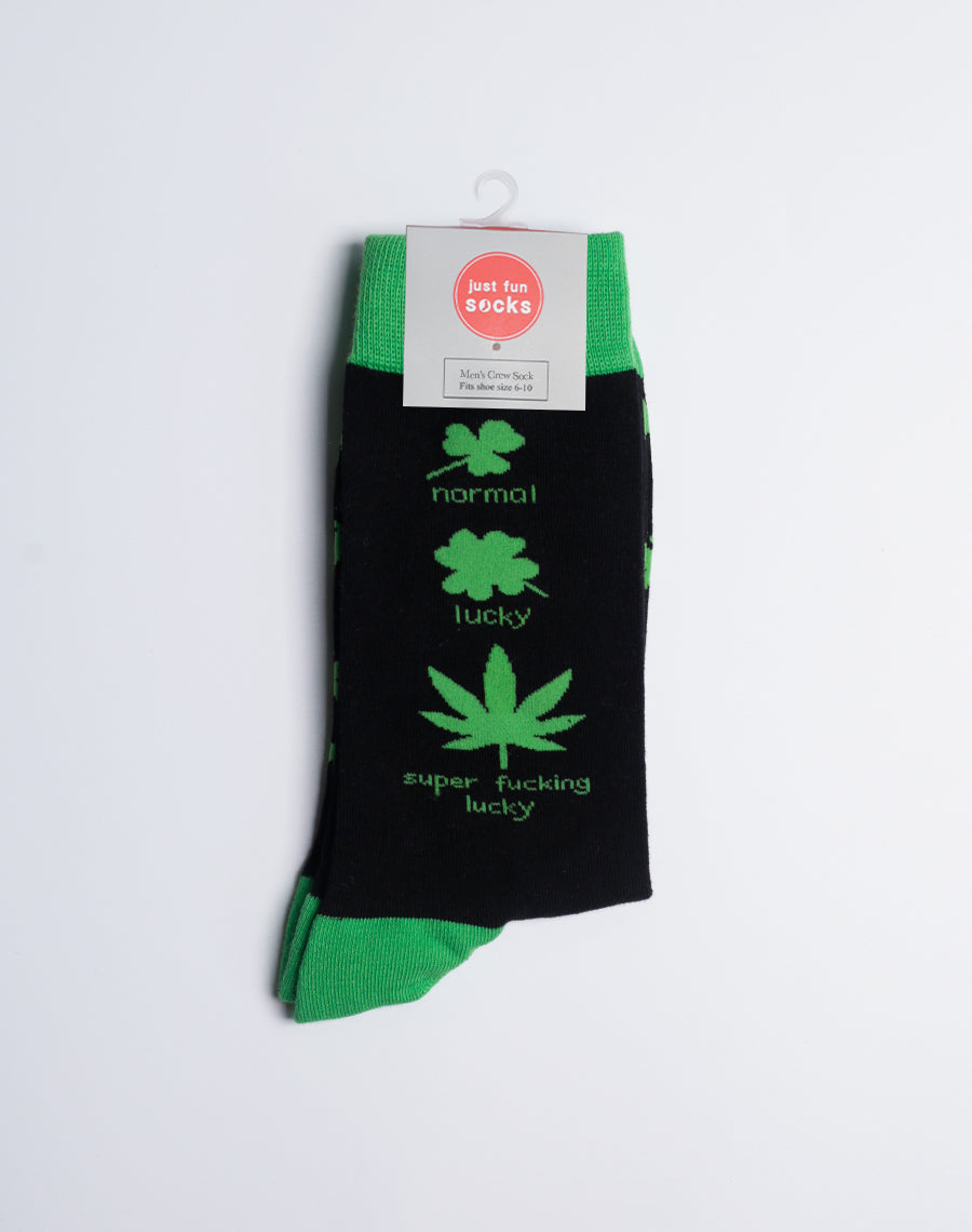 Side view of a person wearing the green and black weed leaf socks, adding a bold statement to their footwear style.
